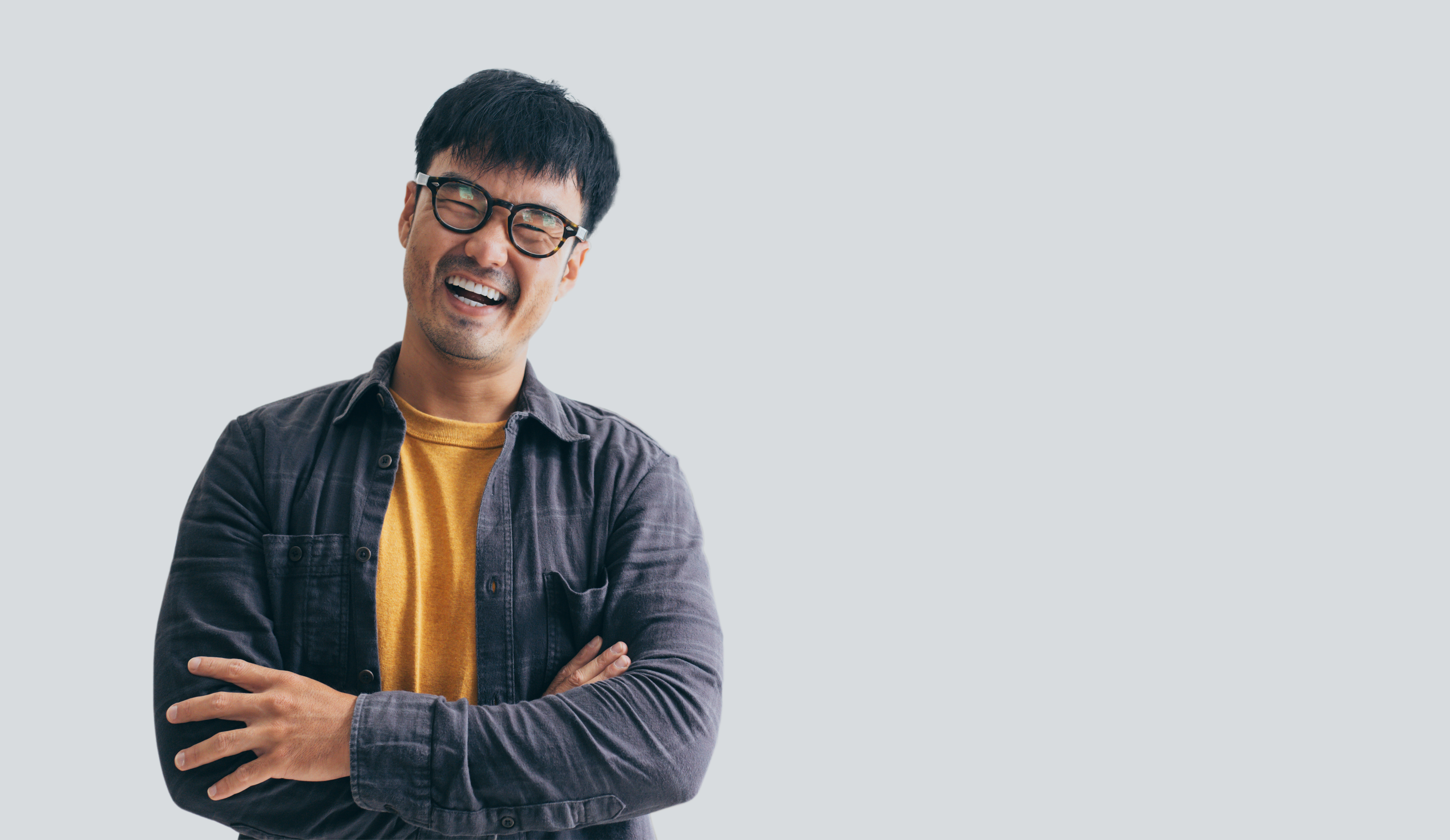asian man portrait young male wear eye glasses smiling cheerful look thinking position with perfect clean skin posing on white background.fashion people life style concept